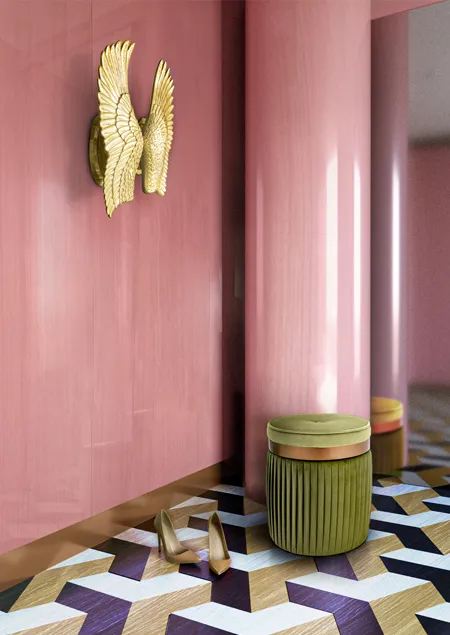 Modern entryway: pink wall, pluma sconce, barcelona pouf and geometric floor.