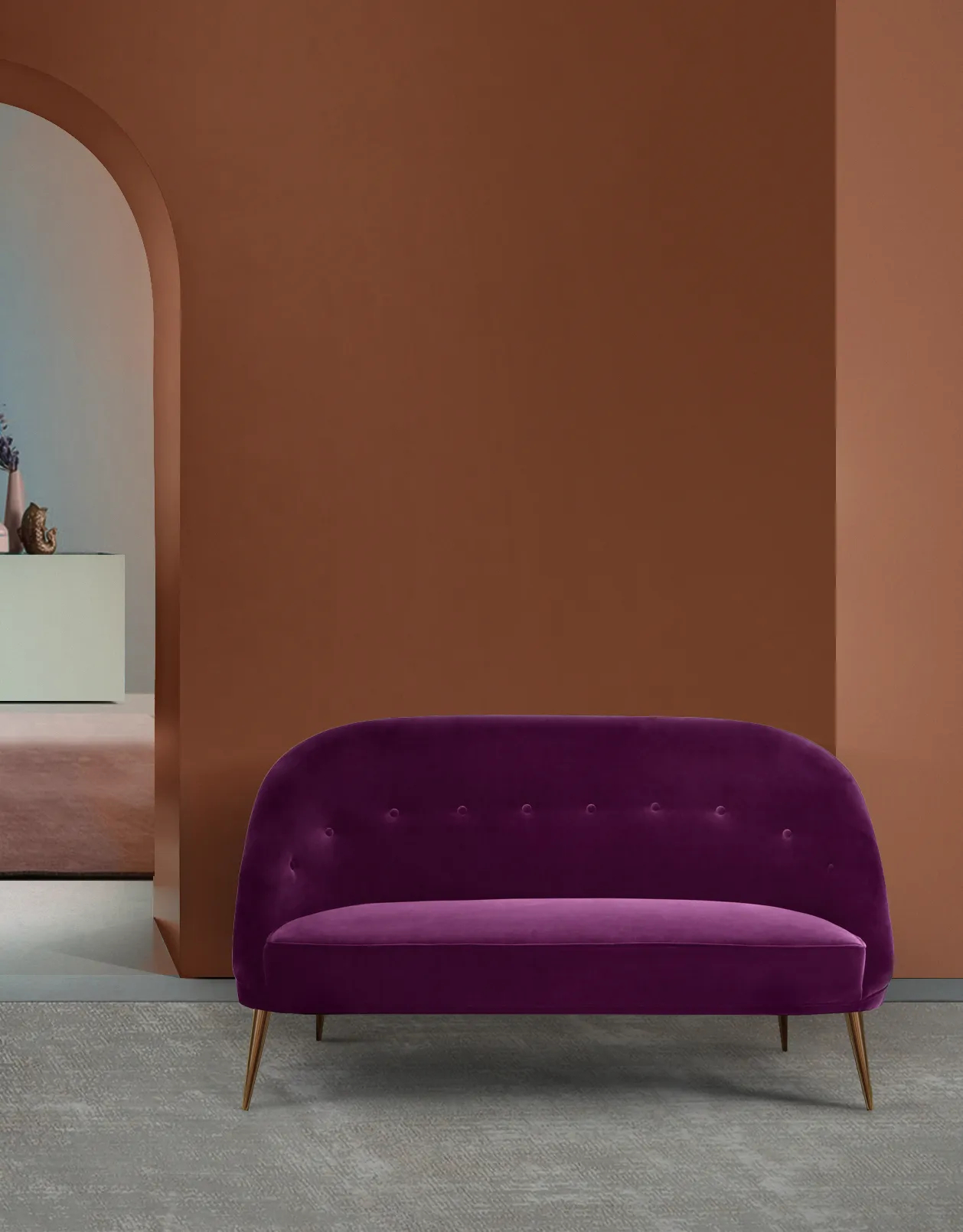 Image of an Aberdeen Sofa by KKbyKOKET, highlighting its plush, purple upholstered design and elegant presence in a stylish terracotta living space.