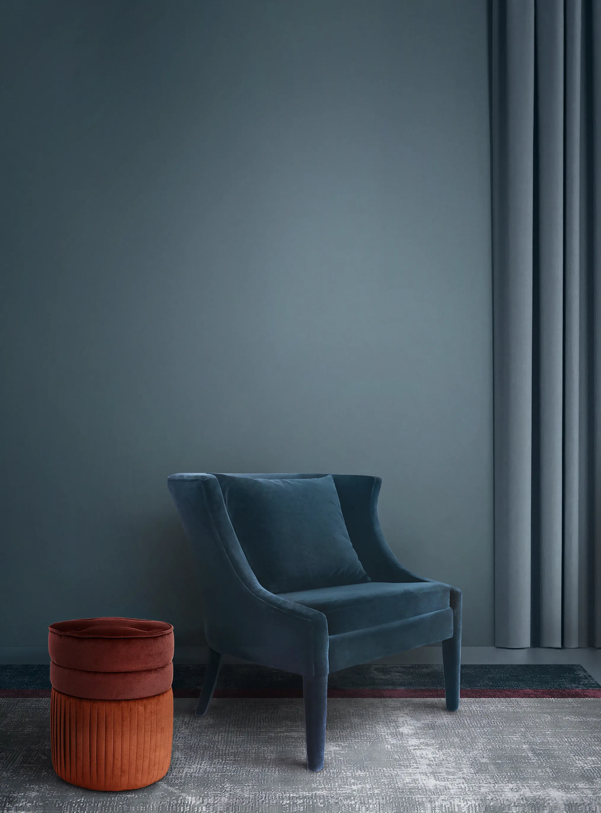 Interior design project featuring the luxurious Athina Chair by KKbyKOKET, upholstered with a dark teal blue fabric and the exquisite Valencia Pouf with contrasting orange tones.