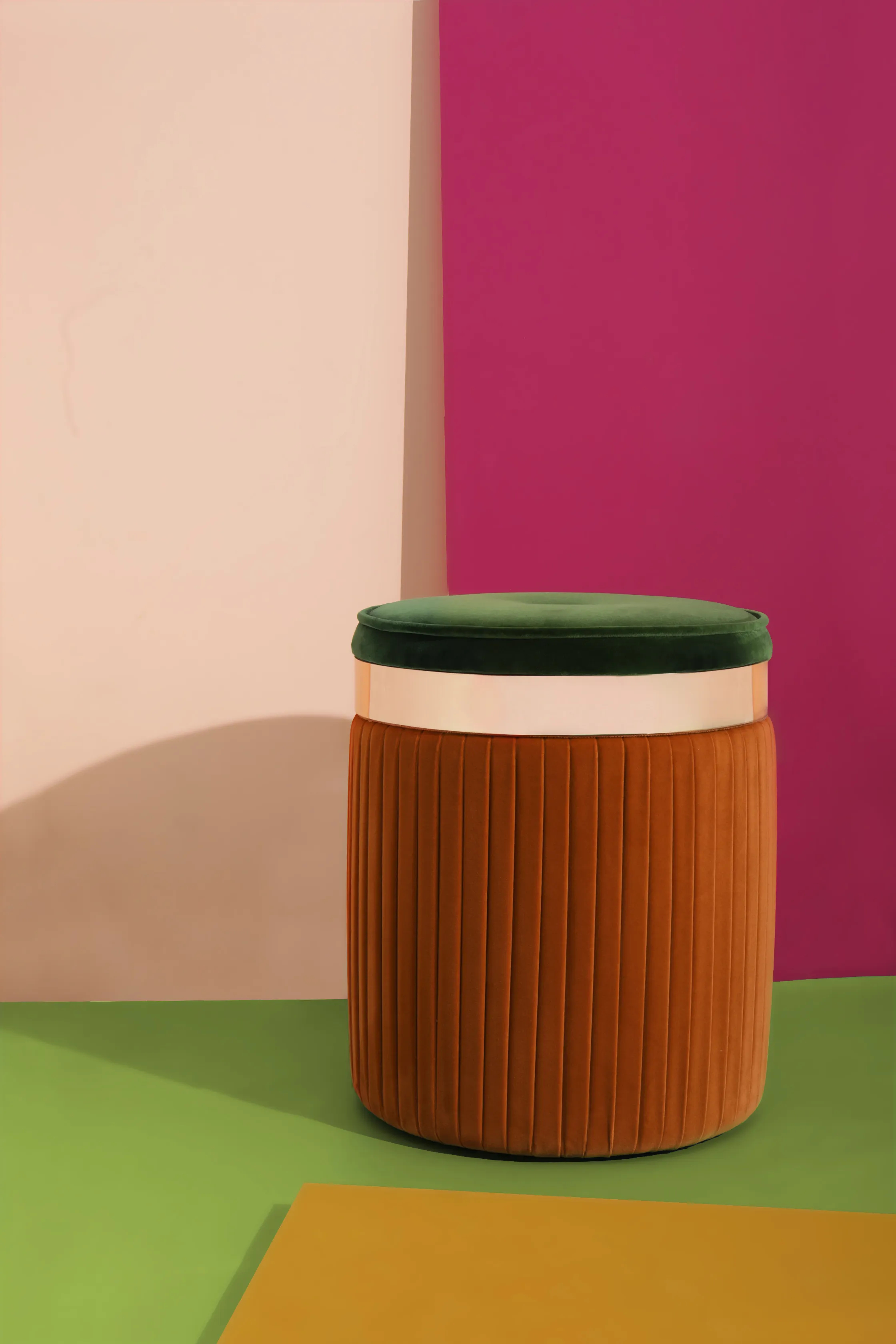 Close-up view of the Barcelona Pouf by KKbyKOKET, showcasing a round fabric cushion with contrasting tones and a shiny gold ring.