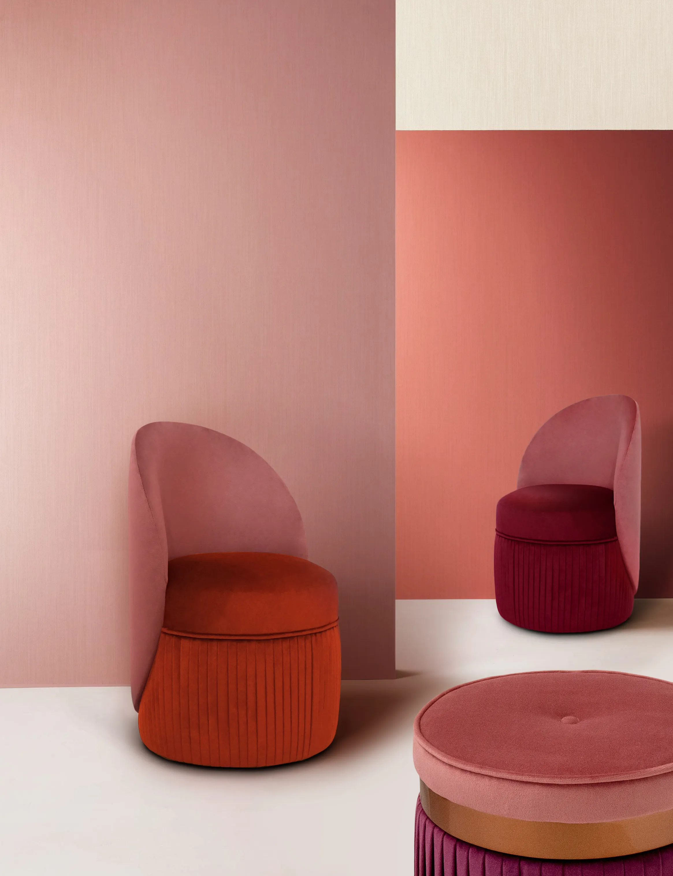 Two luxurious Venice Chairs with different upholstery combinations and intricate stitching, with a matching Barcelona Pouf by KKbyKOKET in a modern, colorful setting.