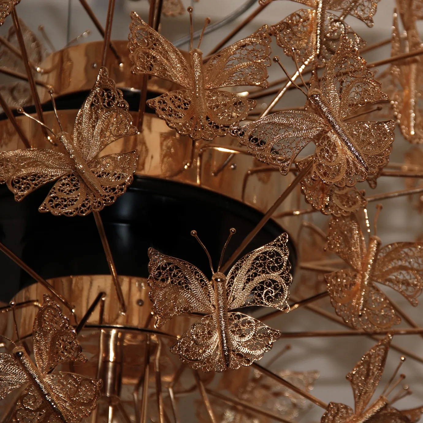 Nymph chandelier details view with an elegant design in the shape of golden butterflies. Perfect for creating a sophisticated and romantic atmosphere.