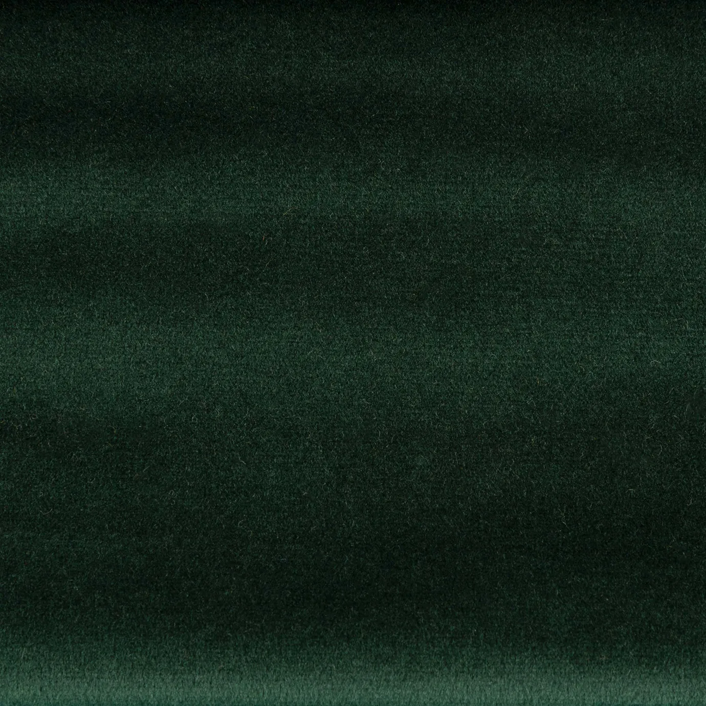 Milano 008 fabric in a deep green tone with a velvety texture, ideal for furniture upholstery and interior decoration with a touch of sophistication and elegance.